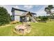 Multi-story home featuring an outdoor fire pit and covered porch for outdoor living and entertainment at 2609 Pleasant Hill Liberty Rd, Liberty, NC 27298