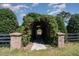 Charming pathway featuring a lush green archway for garden views at 2609 Pleasant Hill Liberty Rd, Liberty, NC 27298