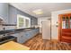 Traditional kitchen features blue cabinets, black countertops and stainless steel appliances at 2609 Pleasant Hill Liberty Rd, Liberty, NC 27298