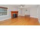 Inviting living room featuring a charming fireplace and beautiful hardwood floors at 2609 Pleasant Hill Liberty Rd, Liberty, NC 27298