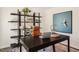 Inviting home office boasts a sleek desk, stylish shelving unit, and comfortable workspace at 261 Holton St, Smithfield, NC 27577
