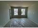Spacious bedroom features light gray walls, a neutral color, and two large windows at 304 Chesapeak Commons St # 146, Garner, NC 27529