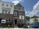 Charming multi-story townhome featuring a brick facade and light-filled windows at 304 Chesapeak Commons St # 146, Garner, NC 27529