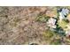 An aerial view of a large house surrounded by trees and a lush green lawn at 4009 Brittabby Ct, Raleigh, NC 27606