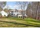 Expansive backyard with green grass and trees, offering plenty of room at 4009 Brittabby Ct, Raleigh, NC 27606