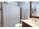 Cozy bathroom featuring a vanity with dark wood cabinets, a sink, a toilet, and a shower with a curtain at 4009 Brittabby Ct, Raleigh, NC 27606