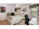 Bedroom with a ceiling fan, a bed with floral bedding, and a heart-shaped mirror at 4009 Brittabby Ct, Raleigh, NC 27606