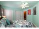 Bedroom with a ceiling fan, comfortable bed, and ample closet space at 4009 Brittabby Ct, Raleigh, NC 27606