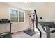 Exercise room featuring workout equipment, a neutral color palette, and a window with natural light at 4009 Brittabby Ct, Raleigh, NC 27606