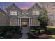 Stately brick home with covered entryway and well-maintained landscaping at 4009 Brittabby Ct, Raleigh, NC 27606