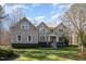 Charming two-story brick home with manicured lawn and mature landscaping at 4009 Brittabby Ct, Raleigh, NC 27606