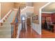 Grand foyer with hardwood floors, staircase, and elegant wainscoting at 4009 Brittabby Ct, Raleigh, NC 27606