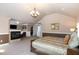 Spacious main bedroom featuring a fireplace, sitting area, walk-in closet and neutral carpet flooring at 4009 Brittabby Ct, Raleigh, NC 27606
