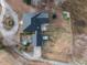 An aerial view showcases the layout of the house, pool, garage, and surrounding property at 4063 Nc-39, Selma, NC 27576