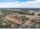 This aerial view highlights the large property, pond, and the surrounding wooded areas at 4063 Nc-39, Selma, NC 27576