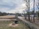 An aerial view of horse property, featuring pastures, paddocks, trees, and home in the distance at 4063 Nc-39, Selma, NC 27576