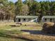Barns in fenced yard with grass and hay at 4063 Nc-39, Selma, NC 27576