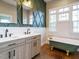 Stylish bathroom with double vanity, clawfoot tub, and elegant finishes at 4063 Nc-39, Selma, NC 27576