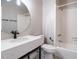 Bathroom featuring a round mirror, single vanity, and tub shower at 4063 Nc-39, Selma, NC 27576