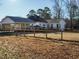 Exterior back of house with large, fenced backyard and covered patio at 4063 Nc-39, Selma, NC 27576