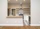 Galley kitchen with stainless steel appliances, butcher block, breakfast bar, and checkered floor at 4063 Nc-39, Selma, NC 27576