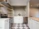 Updated kitchen with stainless steel appliances, farmhouse sink, and floating wood shelves at 4063 Nc-39, Selma, NC 27576