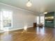 Spacious living room with fireplace, hardwood floors and large windows at 4063 Nc-39, Selma, NC 27576