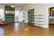 Open living room with fireplace and hardwood floors flows to the bathroom at 4063 Nc-39, Selma, NC 27576