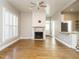 Spacious living room with fireplace, hardwood floors, and lots of natural light at 4063 Nc-39, Selma, NC 27576