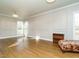 Large living room featuring hardwood floors and decorative molding at 4063 Nc-39, Selma, NC 27576