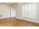 Bright living room with hardwood floors and plantation shutters at 4063 Nc-39, Selma, NC 27576