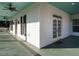 Spacious porch with ceiling fans, painted wood, and views of the yard at 4063 Nc-39, Selma, NC 27576