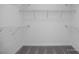 Spacious walk-in closet with wire shelving and neutral carpet, offering ample storage space at 409 Grading Stick Ct, Angier, NC 27501