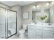 Modern bathroom featuring a glass enclosed shower and double sink vanity at 41 Brazan Ct, Fuquay Varina, NC 27526