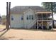 Rear view of the home with a back porch and a yard at 4305 Albino Deer Way, Wake Forest, NC 27587