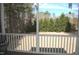Picturesque backyard view from a screened porch overlooking green lawn and trees at 4305 Albino Deer Way, Wake Forest, NC 27587