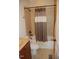 Cozy bathroom featuring tile flooring, a vanity with a sink, and a shower-tub combination at 4305 Albino Deer Way, Wake Forest, NC 27587