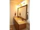 Bathroom vanity features dual sinks, granite countertop, and decorative mirror at 4305 Albino Deer Way, Wake Forest, NC 27587