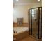 Bathroom boasts a soaking tub, a framed glass shower, and mosaic tile accents at 4305 Albino Deer Way, Wake Forest, NC 27587