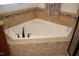 Close up of bathroom with large soaking tub and tile surround at 4305 Albino Deer Way, Wake Forest, NC 27587