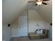 Bonus room with a door, lounge seating, and speakers at 4305 Albino Deer Way, Wake Forest, NC 27587