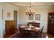 Charming dining area with hardwood floors, a chandelier, and traditional furnishings at 4305 Albino Deer Way, Wake Forest, NC 27587