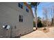 Side exterior showcasing the home's design, siding, and features like windows and utilities at 4305 Albino Deer Way, Wake Forest, NC 27587
