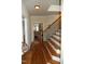 Hallway featuring stairs with decorative iron banisters and hardwood floors at 4305 Albino Deer Way, Wake Forest, NC 27587