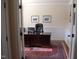 Dedicated office space with a large desk, wainscoting, and built-in bookshelves at 4305 Albino Deer Way, Wake Forest, NC 27587