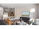 Inviting living area with a stylish sofa, kitchen and modern decor at 452 Belgian Red Way, Wake Forest, NC 27587