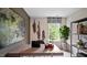 Stylish home office featuring a large desk, ample natural light, and contemporary decor accents at 461 Belgian Red Way, Wake Forest, NC 27587