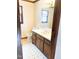 Bathroom with a toilet, window, and wood cabinet at 466 Oren Gaines Rd, Goldston, NC 27252