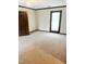 Bedroom with a ceiling fan, carpet flooring, and a door leading to the outside at 466 Oren Gaines Rd, Goldston, NC 27252