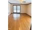 Bedroom with hardwood flooring and a window overlooking a view from the balcony at 466 Oren Gaines Rd, Goldston, NC 27252